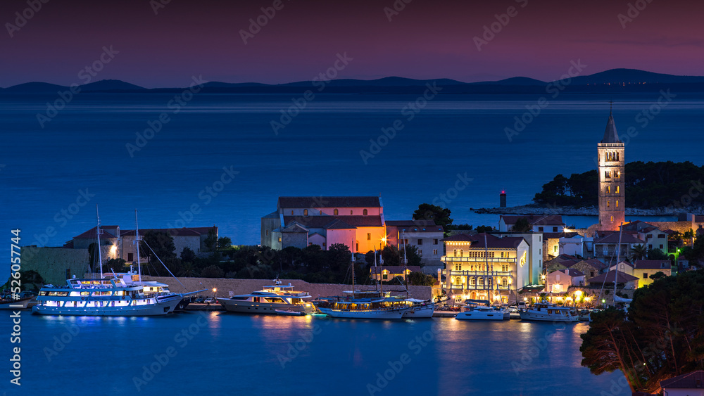 the port of novalja in croatia photographed at night in the form of a long exposure with lights taken in summer