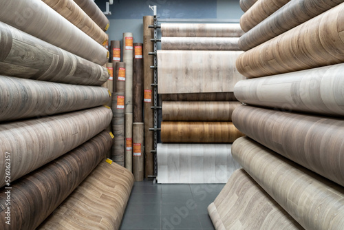 Canvastavla Rolls of new linoleum on the window of a hardware store