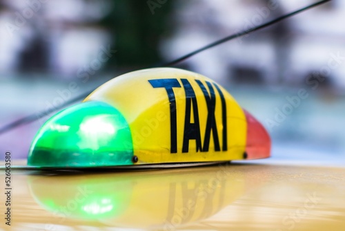 Obraz na plátně Taxi sign on a yellow cab in Bucharest, Romania