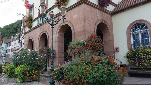 the town hall (translation in french: mairie) in the village Oberbronn in the region Alsace in France in the month of August photo