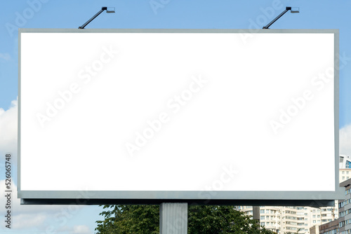 A large billboard on a city street for business information, ads, images.
