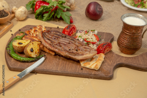 Delicious Turkish Traditional Kebab cutlet with grilled tomato on white plate stock photo
Above, Angle, Animal, Barbecue - Meal, Beef
