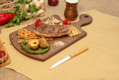 Delicious Turkish Traditional Kebab cutlet with grilled tomato on white plate stock photo
Above, Angle, Animal, Barbecue - Meal, Beef