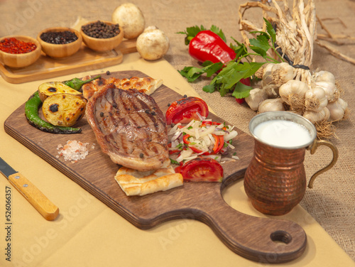 Delicious Turkish Traditional Kebab cutlet with grilled tomato on white plate stock photo
Above, Angle, Animal, Barbecue - Meal, Beef