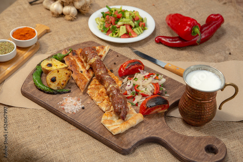 Turkish and Arabian Traditional Adana and Urfa kebab, minced meat kebab. Turkish food culture with salad on rustic wood textured background. Copy Space. stock photo
Kebab, Adana, Wrap Sandwich, Turkis