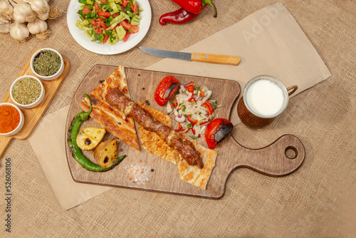 Turkish and Arabian Traditional Adana and Urfa kebab, minced meat kebab. Turkish food culture with salad on rustic wood textured background. Copy Space. stock photo
Kebab, Adana, Wrap Sandwich, Turkis