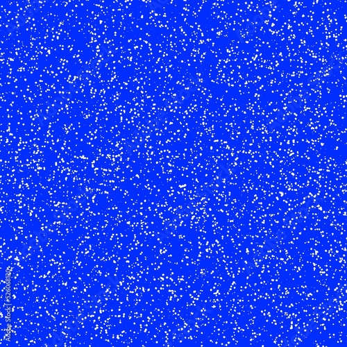 White speckled paper on a blue surface.