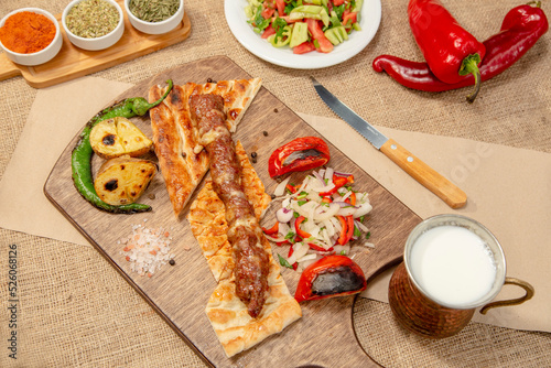 Turkish and Arabian Traditional Adana and Urfa kebab, minced meat kebab. Turkish food culture with salad on rustic wood textured background. Copy Space. stock photo
Kebab, Adana, Wrap Sandwich, Turkis