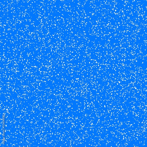 White speckled paper on a blue surface.