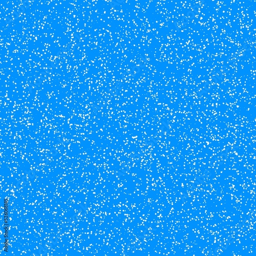 White speckled paper on a blue surface.