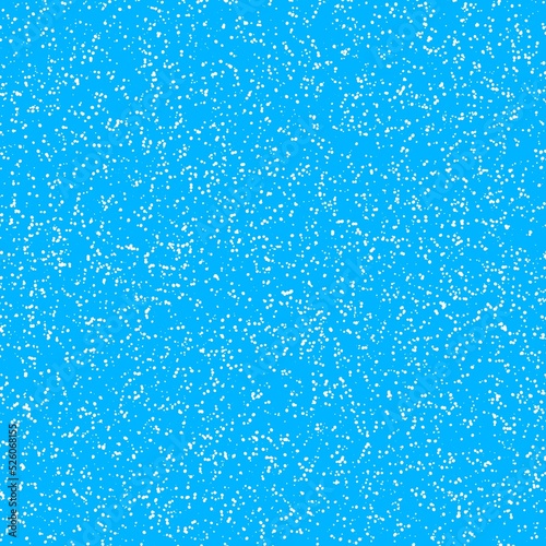 White speckled paper on a blue surface.