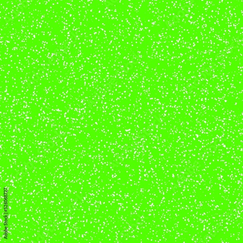 White speckled paper on green surface