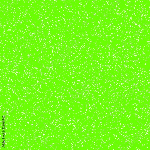 White speckled paper on green surface