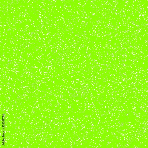 White speckled paper on green surface