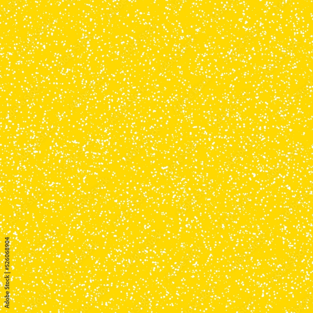 White speckled paper on yellow surface