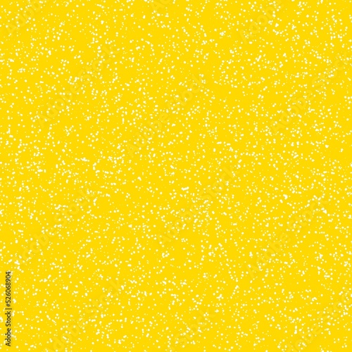 White speckled paper on yellow surface