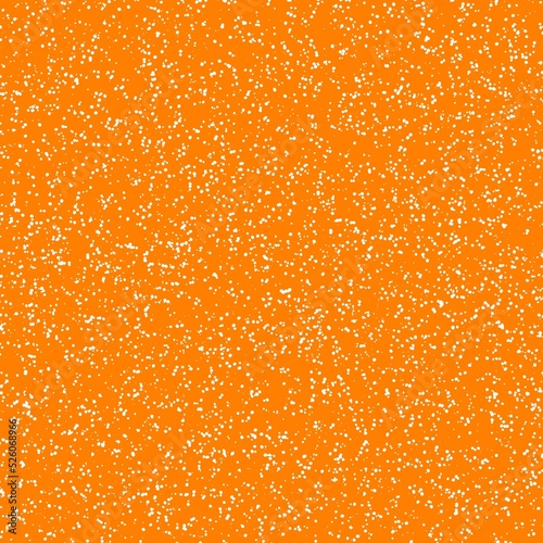 White speckled paper on orange surface