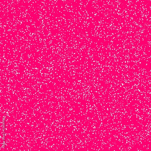 White speckled paper on a pink surface
