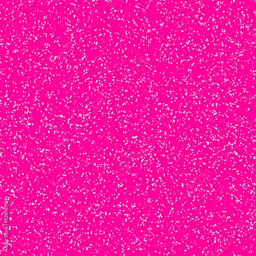 White speckled paper on a pink surface