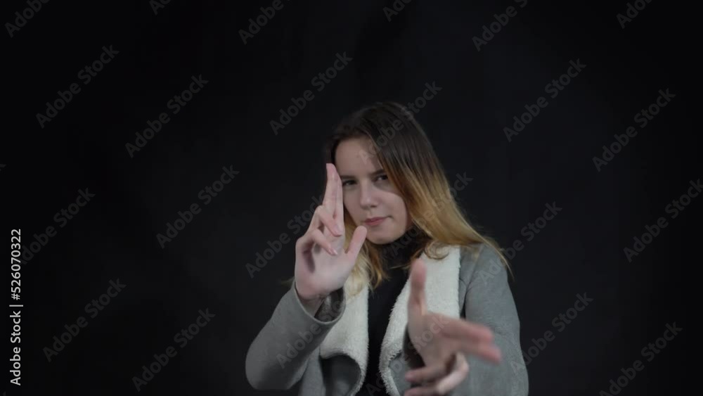 4k Young brunette teenager holding symbolic gun, playing with hand gesture 4k Young brunette teenager holding symbolic gun, playing with hand gesture