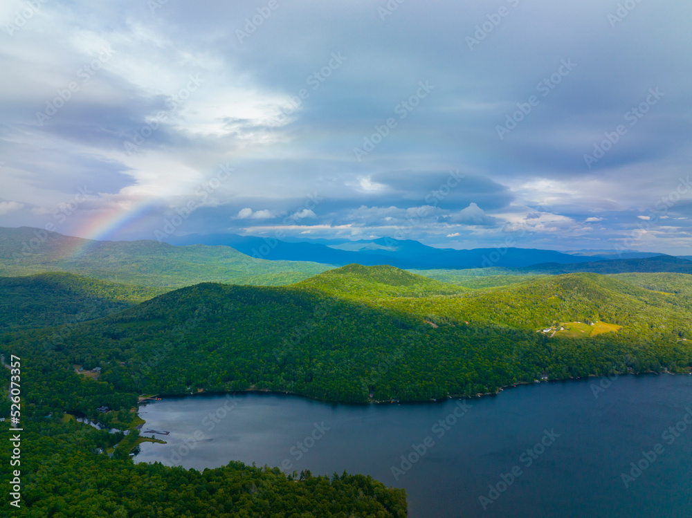 Aerial view of Rainbow over Stinson Lake in White Mountain National Forest in summer in town of Rumney, Grafton County, New Hampshire NH, USA. 