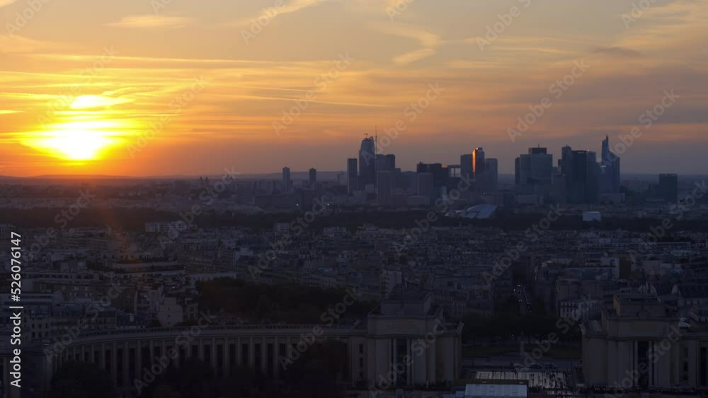 Cityscape of Paris at the end of a day with an orange sunset over the Trocadero and La Defense district Cityscape of Paris at the end of a day with an orange sunset over the Trocadero and La Defense district