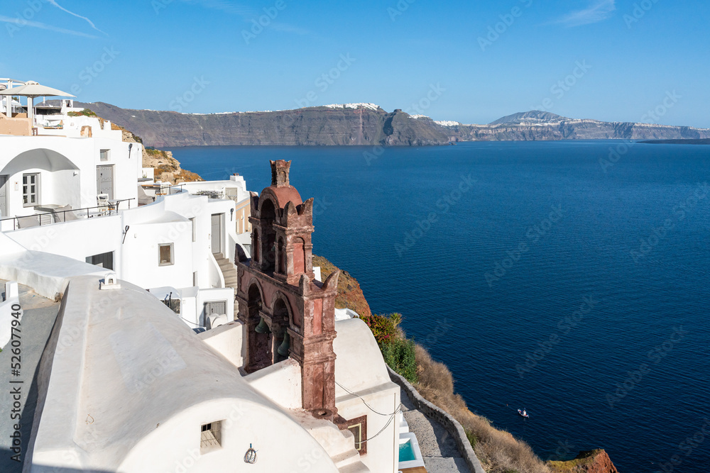 View of Oia Town in Santorini with  traditional cycladic houses overlooking the Sea, Greece