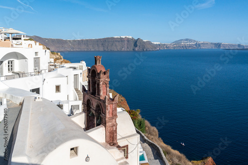 View of Oia Town in Santorini with traditional cycladic houses overlooking the Sea, Greece