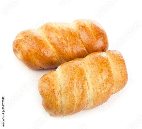 sausage roll , appetizing bun with sausage on a white background
