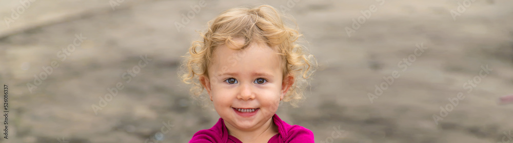 Portrait of a child outdoors girl. Selective focus. Portrait of a child outdoors girl. Selective focus.