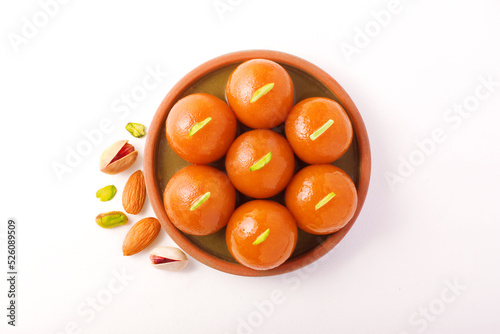 Indian sweet Gulab Jamun served in a round ceramic plate
