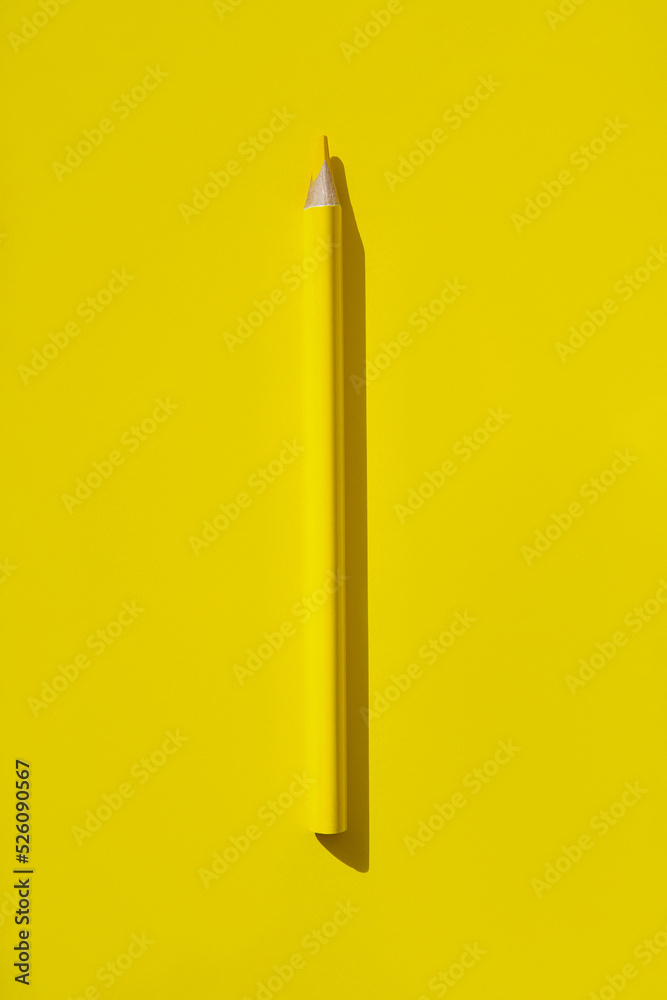 Minimal style composition made of wooden pencil on yellow background. Top view. Flat lay. Back to school concept. Minimal style composition made of wooden pencil on yellow background. Top view. Flat lay. Back to school concept.