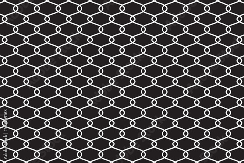 White metallic wire fence pattern on black background