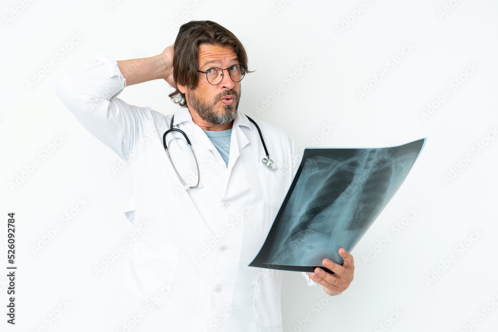 Senior dutch man isolated on white background wearing a doctor gown and holding a bone scan