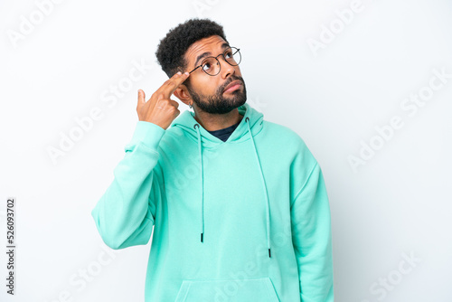 Young Brazilian man isolated on white background with problems making suicide gesture © luismolinero