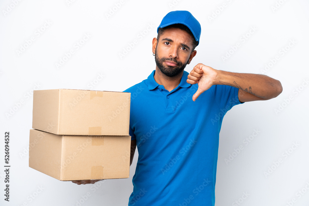 Delivery Brazilian man isolated on white background showing thumb down with negative expression Delivery Brazilian man isolated on white background showing thumb down with negative expression