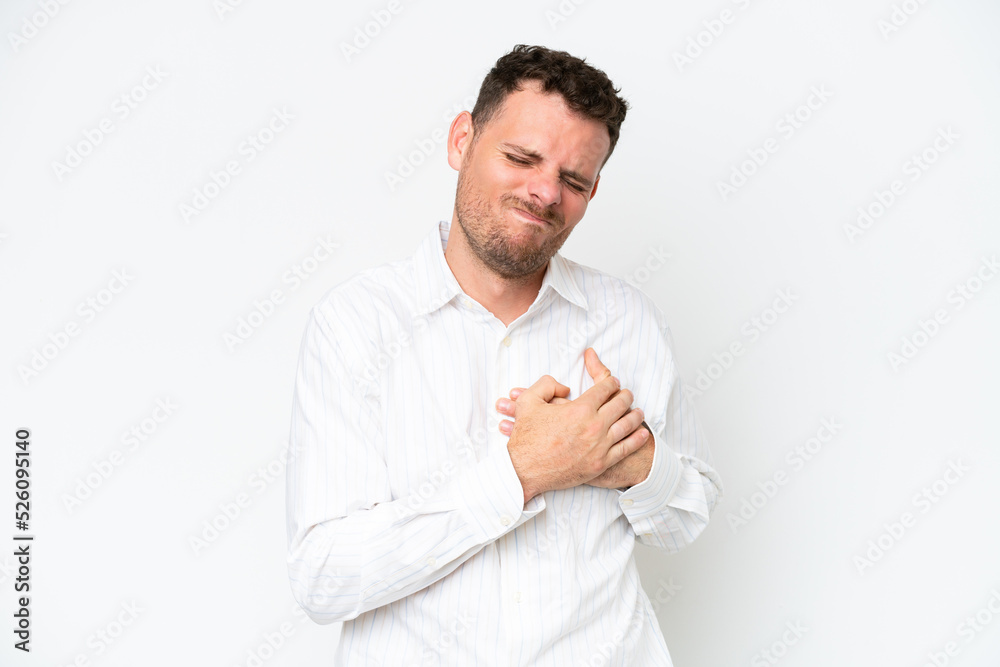 Young caucasian handsome man isolated on white background having a pain in the heart Young caucasian handsome man isolated on white background having a pain in the heart