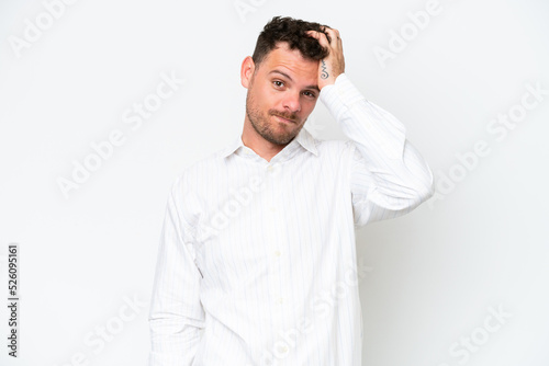 Young caucasian handsome man isolated on white background with an expression of frustration and not understanding © luismolinero