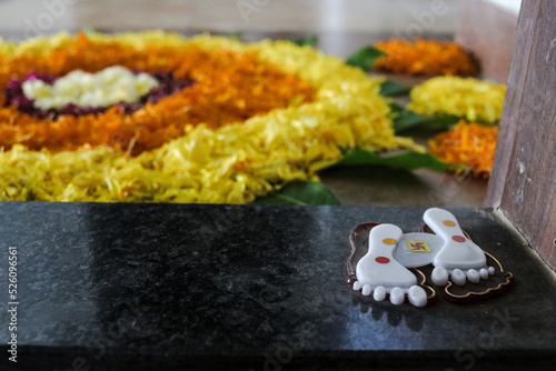 Lovely White Trace of Legs Hindu Goddess Lakshmi For Special Holidays. Special Symbols of Hinduism. Petals Decoration near the Door.  Indian culture. Hindu Festival photo