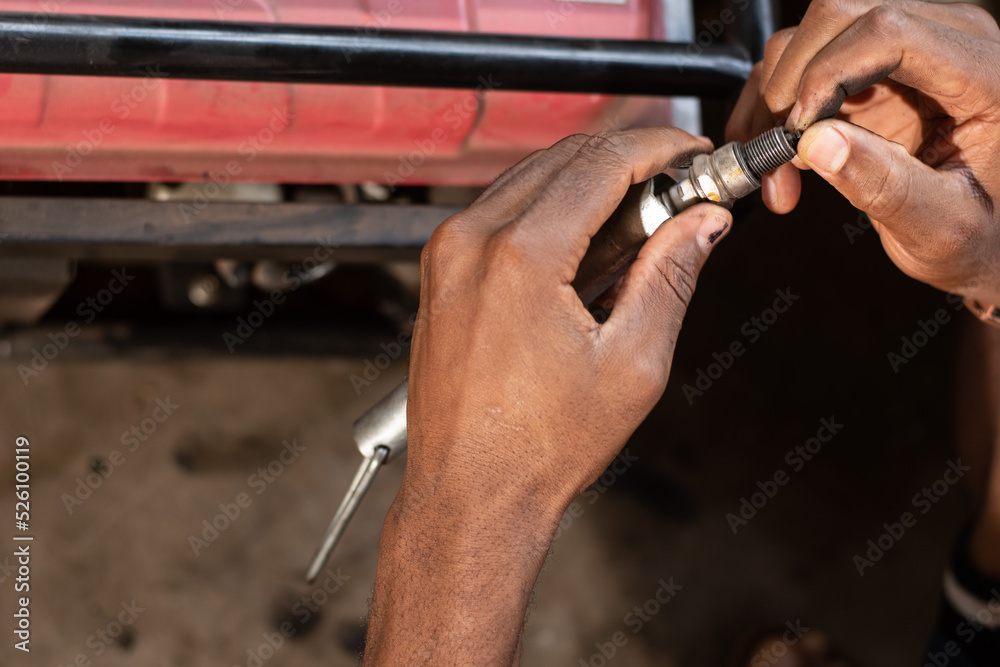 african man working on a generator