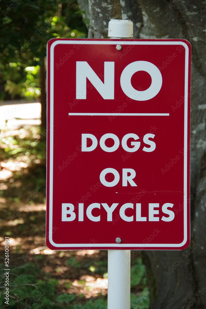 NO DOGS OR BICYCLES sign at a public park