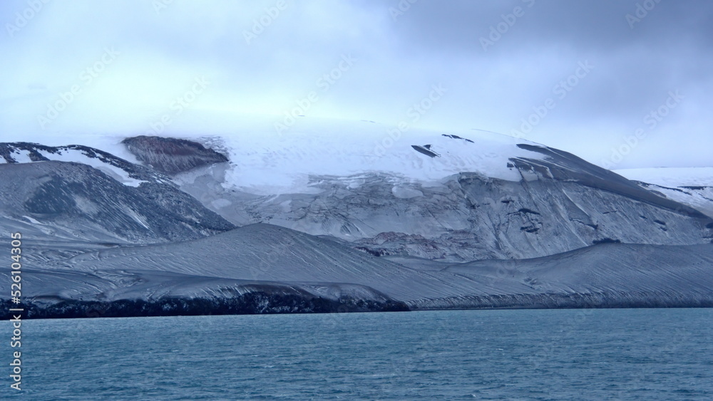 Snow dusted mountains on Deception Island, Antarctica