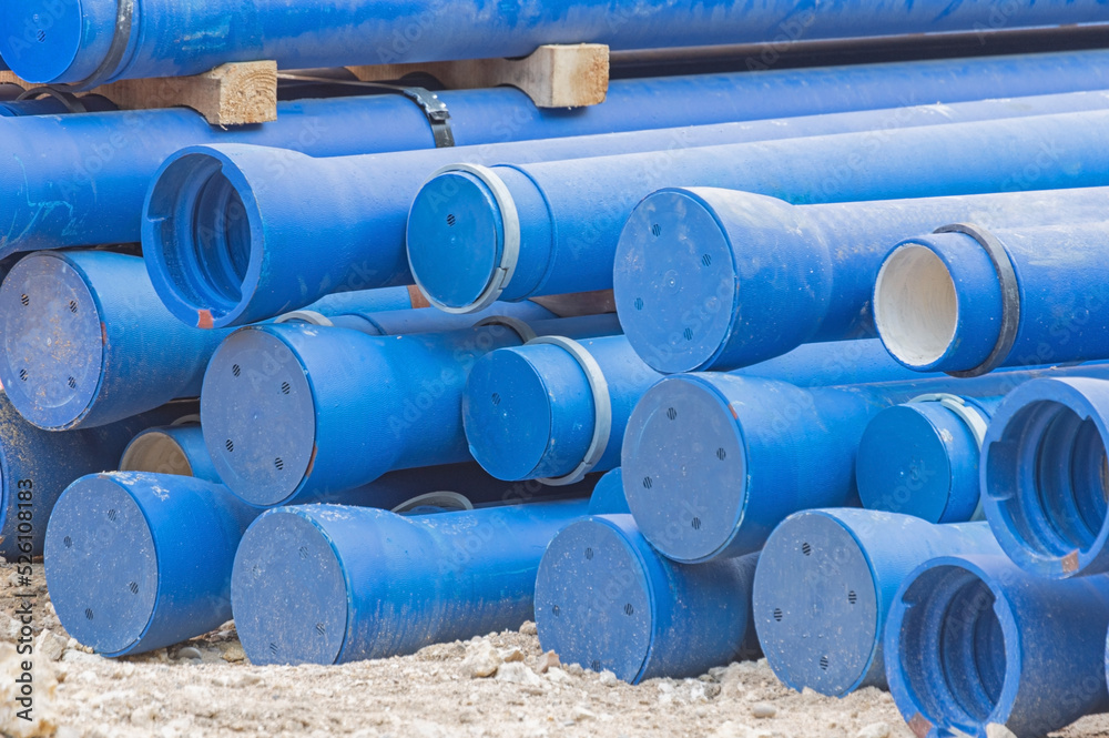 Many long blue industrial plastic pipe Many long blue industrial plastic pipe