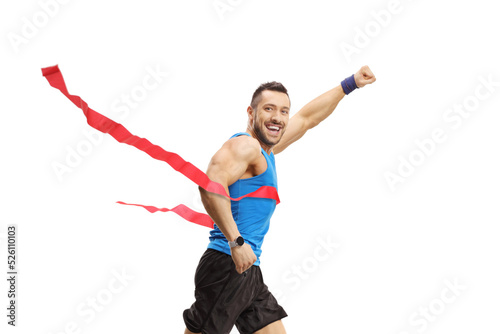 Man on the finish line of a marathon race gesturing win