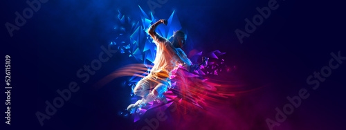 Flyer with young stylish man, breakdanc dancer in motion over dark background with neon colorful elements.