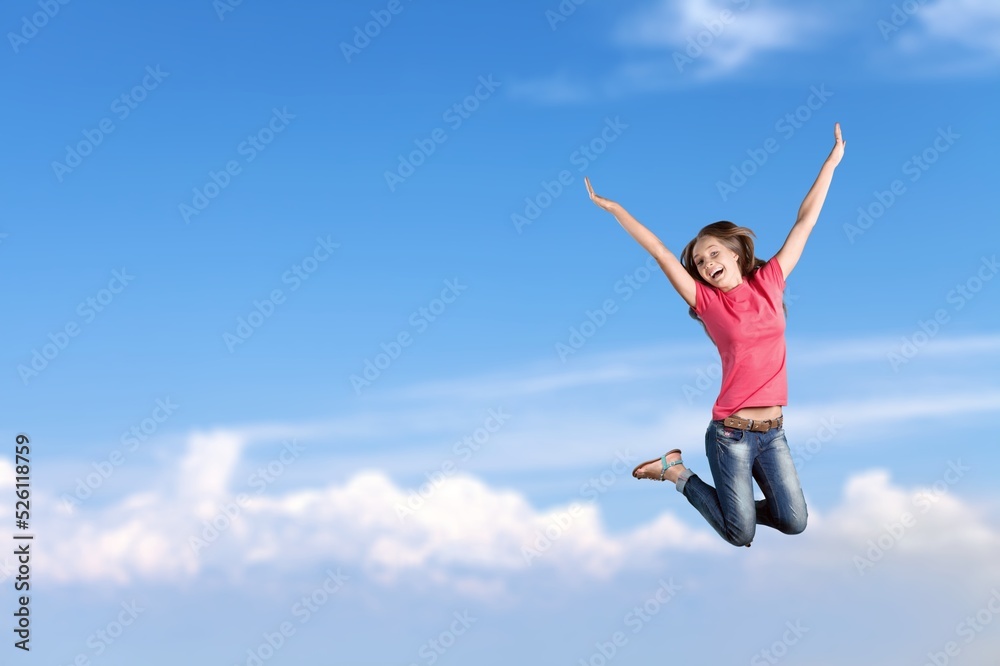 Young smiling happy woman jump high. People lifestyle concept Young smiling happy woman jump high. People lifestyle concept