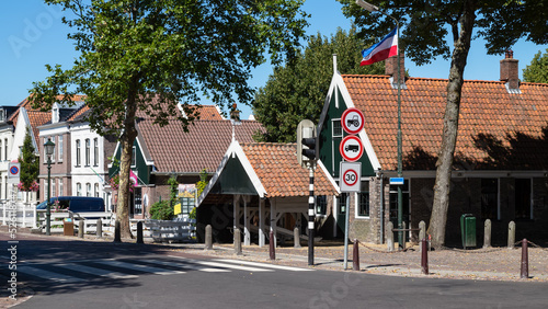 Old traditional wooden houses in the center of the small village of Middenbeemster in North Holland. photo