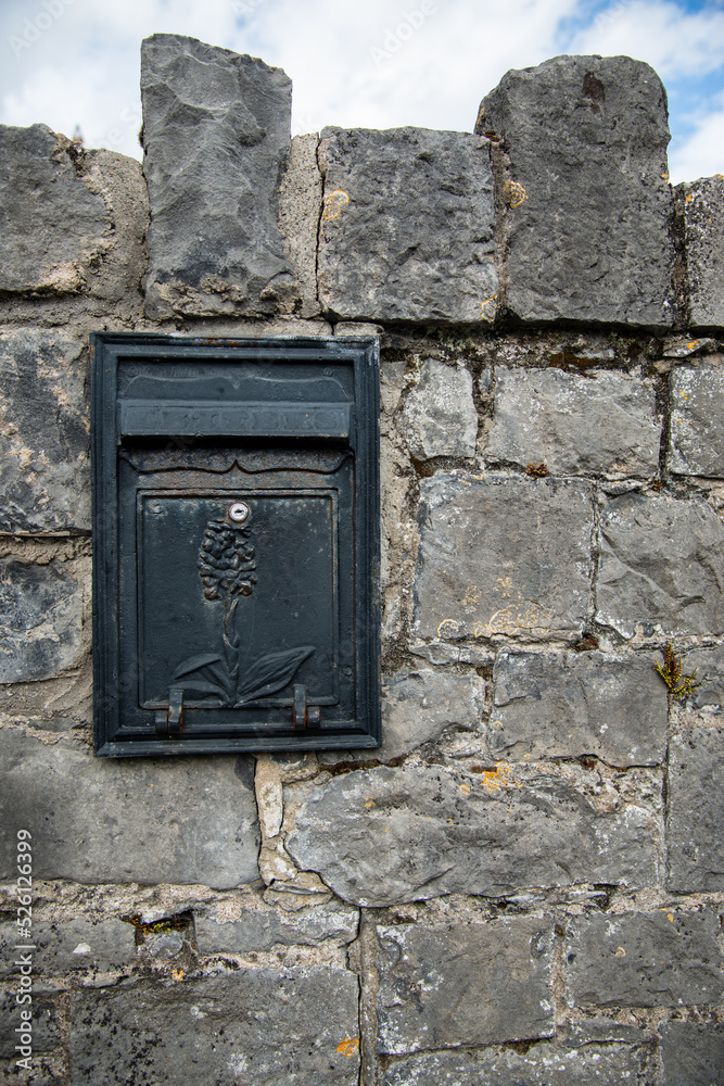 post box, embedded in a stone wall