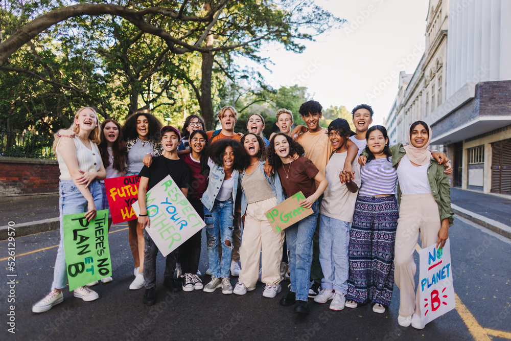 Fototapeta premium Multiethnic young people holding a climate protest