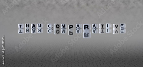 than comparative word or concept represented by black and white letter cubes on a grey horizon background stretching to infinity